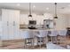 Modern kitchen featuring stainless steel appliances, granite countertops, and seating at the island at 12300 El Prado Dr, Punta Gorda, FL 33955