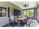 Outdoor dining on the screened lanai with ceiling fan at 12300 El Prado Dr, Punta Gorda, FL 33955