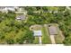 A tranquil aerial view of a home nestled within lush greenery, offering privacy and a serene environment at 1242 Orlando Blvd, Port Charlotte, FL 33952