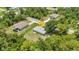 Aerial view of a home nestled among lush trees, offering a sense of privacy and seclusion at 1242 Orlando Blvd, Port Charlotte, FL 33952