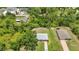 Aerial view of a single-Gathering home showcasing the lot and adjacent properties at 1242 Orlando Blvd, Port Charlotte, FL 33952