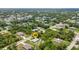 Aerial view of a property in a lush residential neighborhood at 1242 Orlando Blvd, Port Charlotte, FL 33952