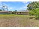 Large backyard offering ample space for outdoor activities and relaxation at 1242 Orlando Blvd, Port Charlotte, FL 33952