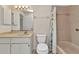 Bathroom featuring a single sink vanity, toilet, and shower-tub combo at 1242 Orlando Blvd, Port Charlotte, FL 33952