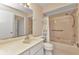 Bathroom featuring a single sink vanity, toilet, and shower-tub combo at 1242 Orlando Blvd, Port Charlotte, FL 33952