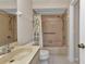Bathroom featuring a single sink vanity, toilet, and shower-tub combo at 1242 Orlando Blvd, Port Charlotte, FL 33952