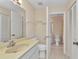 Bathroom featuring a single sink vanity, toilet, and linen closet at 1242 Orlando Blvd, Port Charlotte, FL 33952