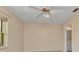 Bright bedroom with a ceiling fan and an attached bathroom with modern fixtures at 1242 Orlando Blvd, Port Charlotte, FL 33952