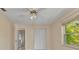 Bedroom featuring a ceiling fan, closet, and a view of the hallway at 1242 Orlando Blvd, Port Charlotte, FL 33952