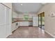 Well-equipped kitchen with stainless steel appliances and direct access to outdoor patio at 1242 Orlando Blvd, Port Charlotte, FL 33952