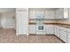 Well-equipped kitchen with classic white cabinets and appliances at 1242 Orlando Blvd, Port Charlotte, FL 33952