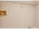 Bright laundry area equipped with necessary utility connections and a shelf at 1242 Orlando Blvd, Port Charlotte, FL 33952