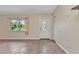 The living room offers a large window with natural light and a front door with decorative glass at 1242 Orlando Blvd, Port Charlotte, FL 33952