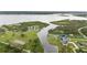 Aerial view highlighting the property's location on a waterfront canal with beautiful scenery at 12581 Eisenhower Dr, Port Charlotte, FL 33953