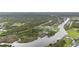 Beautiful view from above shows waterfront land amongst trees and water at 12581 Eisenhower Dr, Port Charlotte, FL 33953