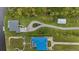 Aerial view of the home showcasing the meticulously designed landscaping and convenient circular driveway at 12581 Eisenhower Dr, Port Charlotte, FL 33953