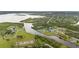 Aerial view of the property on the water, highlighting lush landscaping and community at 12581 Eisenhower Dr, Port Charlotte, FL 33953