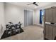 Spacious bedroom with grey closet doors, carpet and drum set at 12581 Eisenhower Dr, Port Charlotte, FL 33953