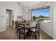 Dining room with waterfront views and a modern chandelier at 12581 Eisenhower Dr, Port Charlotte, FL 33953
