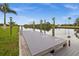 Wooden dock featuring sturdy pilings and space for boat docking, ideal for waterfront access and enjoyment at 12581 Eisenhower Dr, Port Charlotte, FL 33953