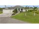 Stunning single-Gathering home with meticulously maintained landscaping and a spacious three-car garage at 12581 Eisenhower Dr, Port Charlotte, FL 33953