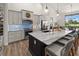 Modern kitchen featuring gray cabinetry, marble countertops, and stainless steel appliances at 12581 Eisenhower Dr, Port Charlotte, FL 33953