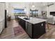 Kitchen island with seating, dishwasher, and stainless steel appliances at 12581 Eisenhower Dr, Port Charlotte, FL 33953
