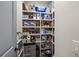 Walk-in pantry with shelving units, storage, and ample space at 12581 Eisenhower Dr, Port Charlotte, FL 33953