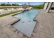 Beautiful pool featuring a spa with mosaic crab designs in an elegant outdoor oasis at 12581 Eisenhower Dr, Port Charlotte, FL 33953