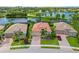 A beautiful house in a serene lakeside community, surrounded by lush landscaping at 13136 N Marsh Dr, Port Charlotte, FL 33953