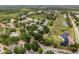Aerial view of a community with beautiful landscaping, golf course, and waterfront at 13136 N Marsh Dr, Port Charlotte, FL 33953