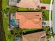 An aerial perspective shows a home with a screened pool and well-manicured landscaping at 13136 N Marsh Dr, Port Charlotte, FL 33953