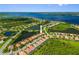 Aerial view of a charming neighborhood with waterfront homes and lush greenery, offering a serene and picturesque setting at 13136 N Marsh Dr, Port Charlotte, FL 33953