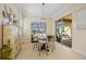 Cozy breakfast nook with a round table, counter seating, and view of the outdoor living area at 13136 N Marsh Dr, Port Charlotte, FL 33953