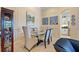 Formal dining area featuring a glass table with seating for six and decorative wall panels at 13136 N Marsh Dr, Port Charlotte, FL 33953