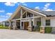 Welcoming entrance to the Pro Shop, featuring a stone base and vaulted entrance, creating a warm and inviting atmosphere at 13136 N Marsh Dr, Port Charlotte, FL 33953