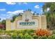 Riverwood community sign surrounded by colorful plants and landscaping at 13136 N Marsh Dr, Port Charlotte, FL 33953