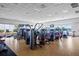 A spacious fitness center with modern equipment and large windows provides a bright workout environment at 13136 N Marsh Dr, Port Charlotte, FL 33953