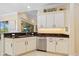 Well-appointed kitchen featuring granite counters, stainless appliances, and abundant cabinetry at 13136 N Marsh Dr, Port Charlotte, FL 33953