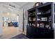 Elegant hallway with archway leads into a living room with stylish furnishings and open floor plan at 13136 N Marsh Dr, Port Charlotte, FL 33953