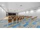 A well-lit meeting room with modern chairs and a projector screen offers a versatile space for events at 13136 N Marsh Dr, Port Charlotte, FL 33953