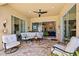 Comfortable covered patio perfect for outdoor relaxation and entertaining with garden views at 13136 N Marsh Dr, Port Charlotte, FL 33953