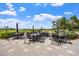 Charming outdoor patio featuring elegant tables and chairs set amongst picturesque views, perfect for al fresco dining at 13136 N Marsh Dr, Port Charlotte, FL 33953