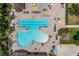Overhead view of an expansive community pool with lap lanes, resort style tanning, and hot tub at 13136 N Marsh Dr, Port Charlotte, FL 33953