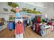 Charming pro shop interior featuring golf apparel, equipment displays, and a whimsical mural creating a unique shopping experience at 13136 N Marsh Dr, Port Charlotte, FL 33953