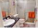 Practical bathroom featuring a sink, a toilet, and a shower with sliding glass doors at 1389 Hinton St, Port Charlotte, FL 33952