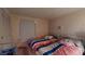 Inviting shared bedroom with two beds, neutral decor, and a window for natural light at 1389 Hinton St, Port Charlotte, FL 33952