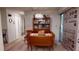 Cozy dining room featuring a wooden table, display cabinet, and access to adjacent rooms, perfect for gatherings at 1389 Hinton St, Port Charlotte, FL 33952
