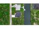 Aerial view of the house with its boat dock on the water, and adjacent to a neighbor's home at 14166 Fort Worth Cir, Port Charlotte, FL 33981