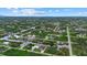 Aerial view of property showcasing its canal-front location within a lush residential community at 14166 Fort Worth Cir, Port Charlotte, FL 33981